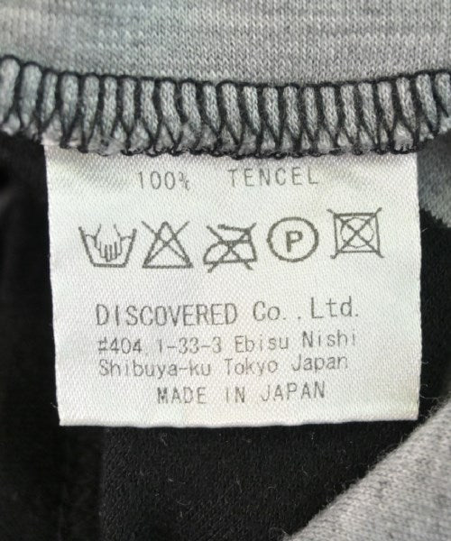 DISCOVERED เสื้อยืด/เสื้อท็อปส์