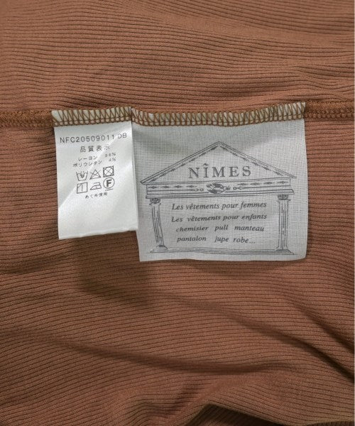 NIMES เสื้อยืด/เสื้อท็อปส์