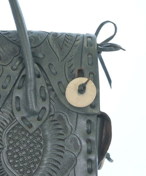 Carving Tribes กระเป๋าถือ