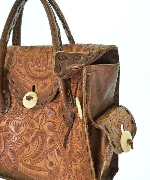 Carving Tribes กระเป๋าถือ