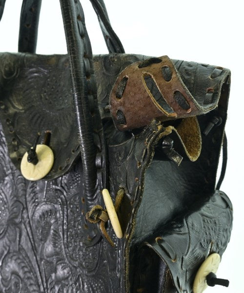 Carving Tribes กระเป๋าถือ