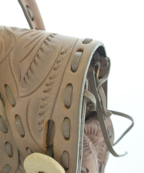 Carving Tribes กระเป๋าถือ