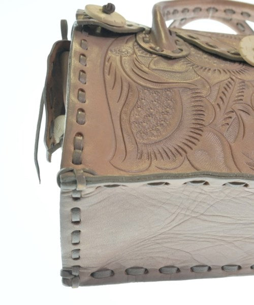 Carving Tribes กระเป๋าถือ