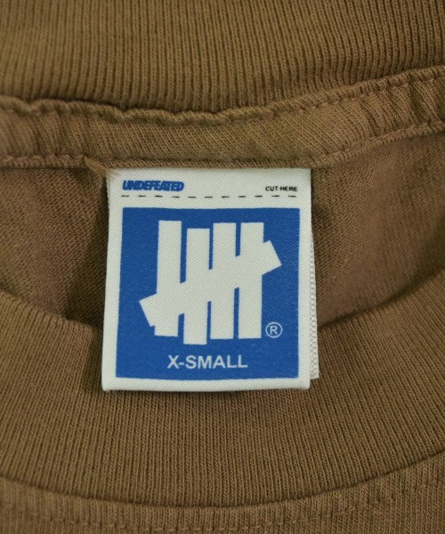 UNDEFEATED เสื้อยืด/เสื้อท็อปส์