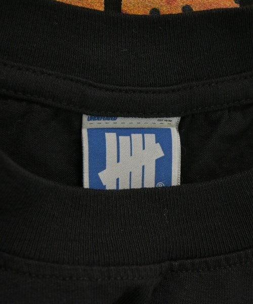 UNDEFEATED เสื้อยืด/เสื้อท็อปส์