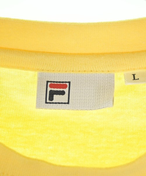 FILA เสื้อยืด/เสื้อท็อปส์
