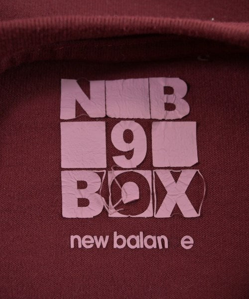 New Balance เสื้อยืด/เสื้อท็อปส์