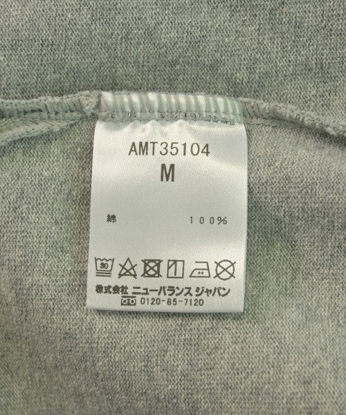 New Balance เสื้อยืด/เสื้อท็อปส์