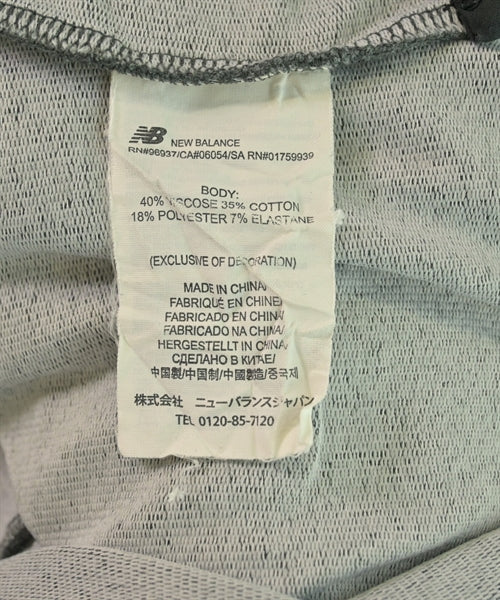 New Balance เสื้อยืด/เสื้อท็อปส์