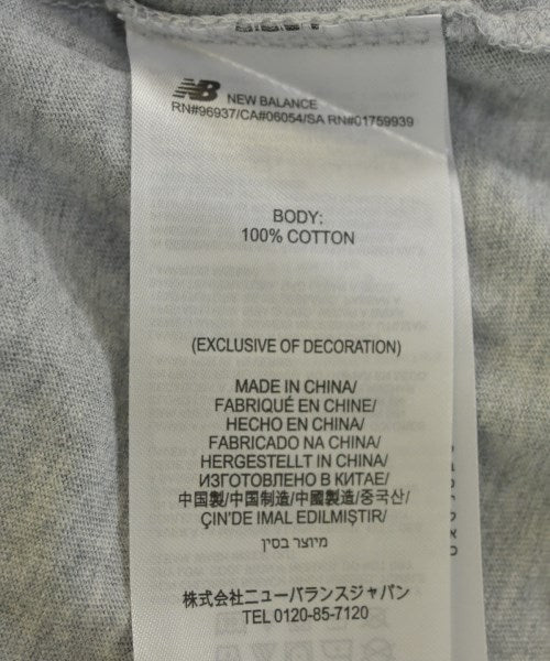 New Balance เสื้อยืด/เสื้อท็อปส์