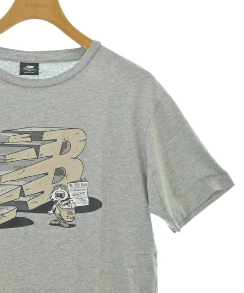 New Balance เสื้อยืด/เสื้อท็อปส์