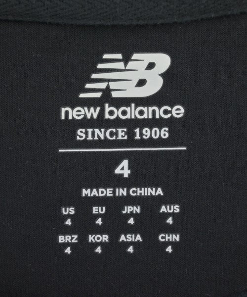 New Balance เสื้อยืด/เสื้อท็อปส์