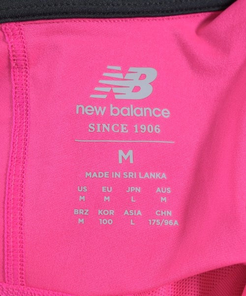 New Balance เสื้อยืด/เสื้อท็อปส์