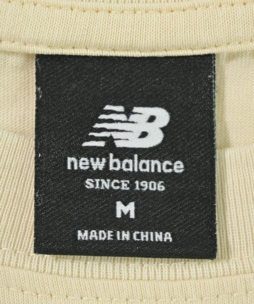 New Balance เสื้อยืด/เสื้อท็อปส์