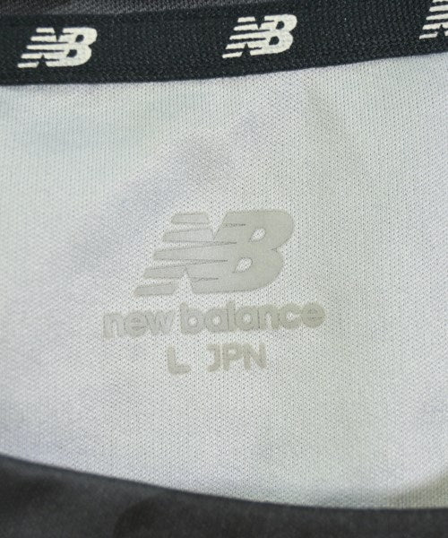 New Balance เสื้อยืด/เสื้อท็อปส์