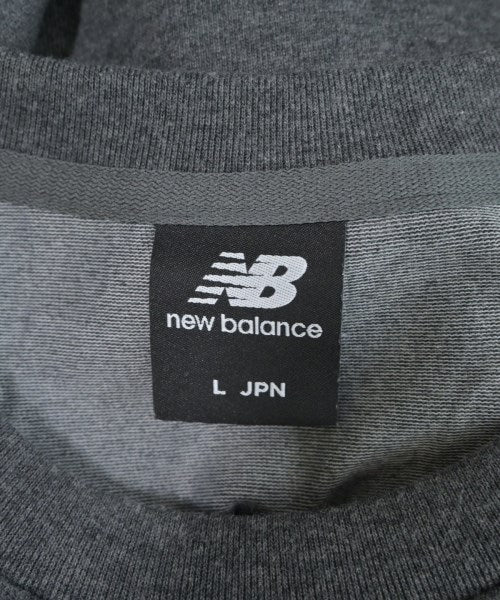 New Balance เสื้อยืด/เสื้อท็อปส์