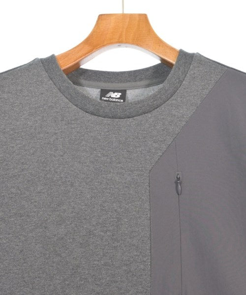 New Balance เสื้อยืด/เสื้อท็อปส์