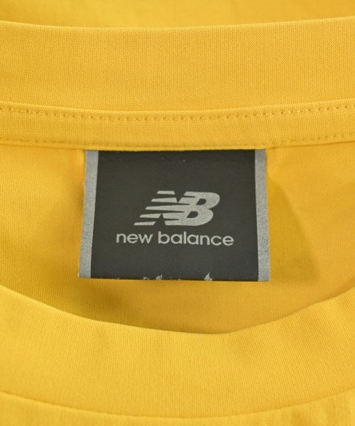 New Balance เสื้อยืด/เสื้อท็อปส์