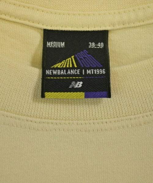 New Balance เสื้อยืด/เสื้อท็อปส์