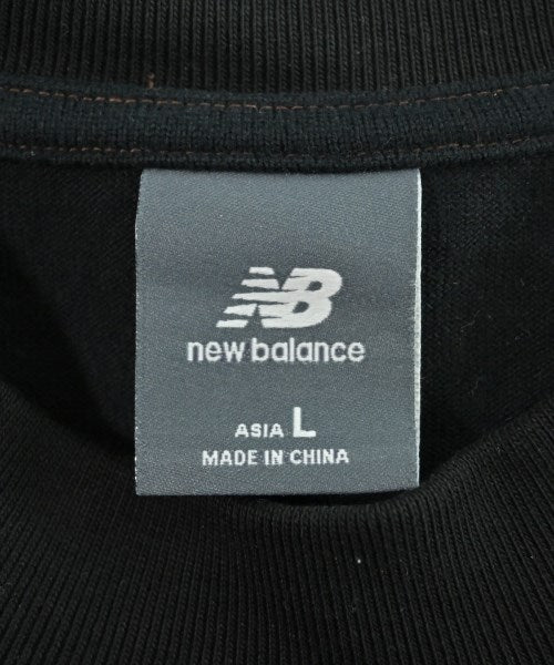 New Balance เสื้อยืด/เสื้อท็อปส์