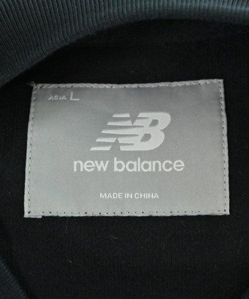 New Balance เสื้อยืด/เสื้อท็อปส์