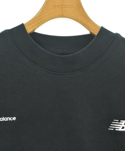 New Balance เสื้อยืด/เสื้อท็อปส์