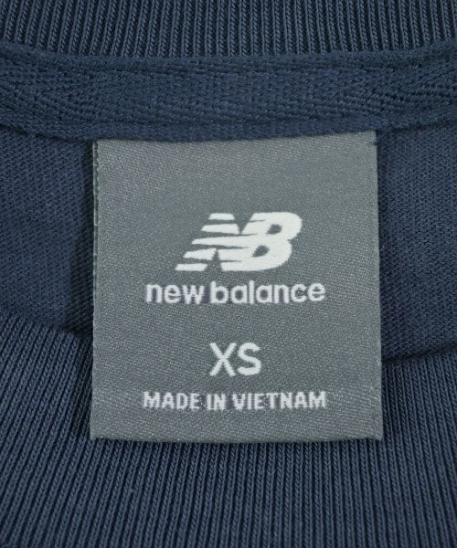 New Balance เสื้อยืด/เสื้อท็อปส์