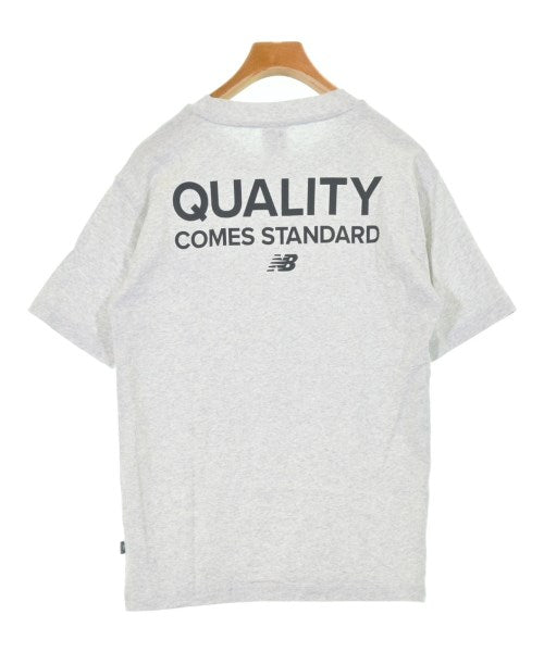 New Balance เสื้อยืด/เสื้อท็อปส์