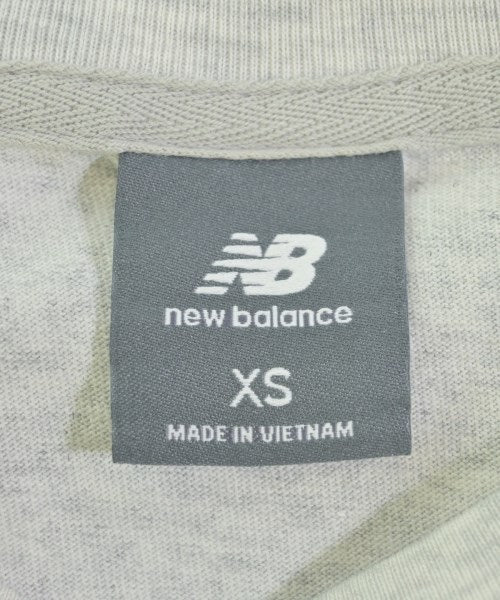 New Balance เสื้อยืด/เสื้อท็อปส์
