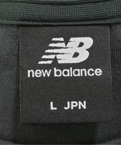 New Balance เสื้อยืด/เสื้อท็อปส์