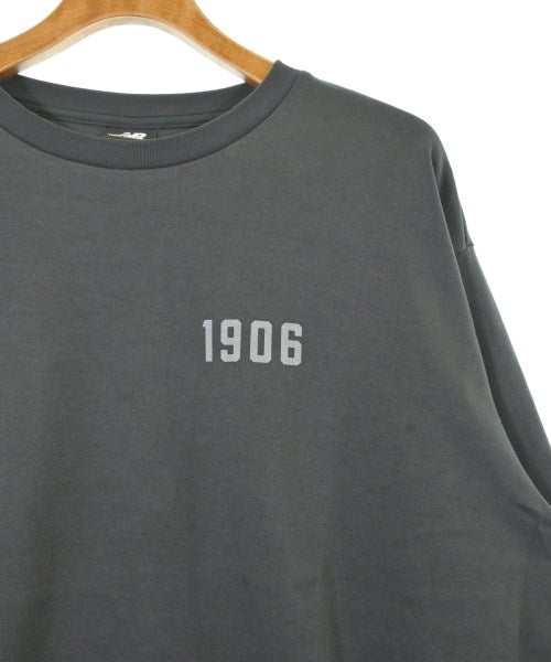 New Balance เสื้อยืด/เสื้อท็อปส์