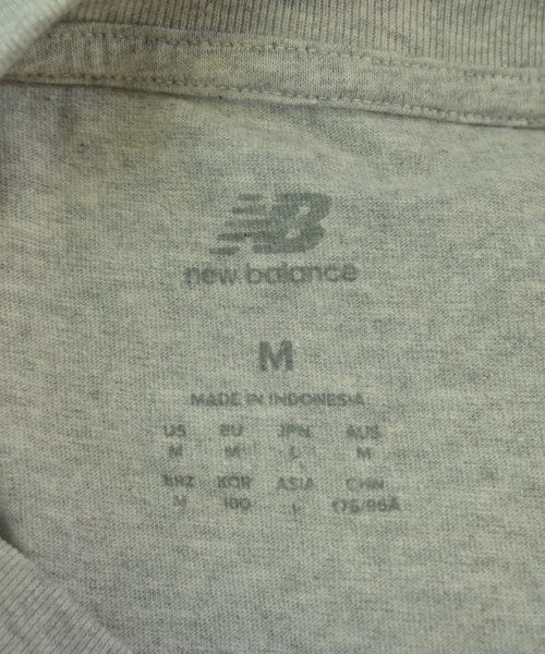 New Balance เสื้อยืด/เสื้อท็อปส์