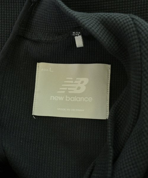 New Balance เสื้อยืด/เสื้อท็อปส์