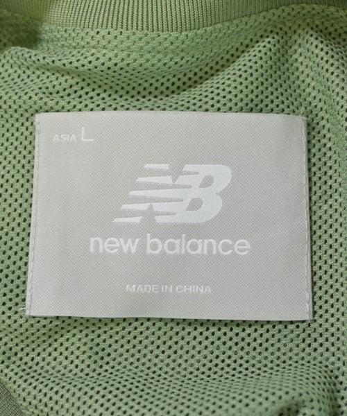 New Balance เสื้อยืด/เสื้อท็อปส์