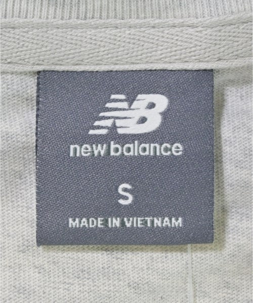 New Balance เสื้อยืด/เสื้อท็อปส์