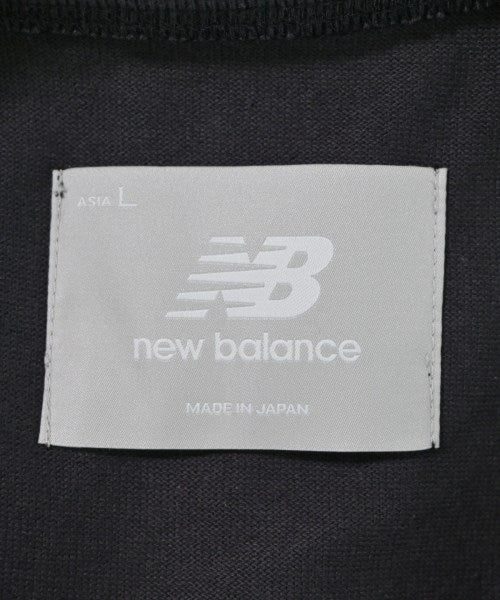 New Balance เสื้อยืด/เสื้อท็อปส์