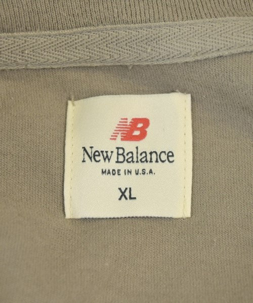 New Balance เสื้อยืด/เสื้อท็อปส์