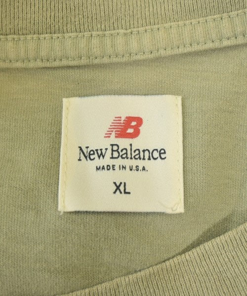 New Balance เสื้อยืด/เสื้อท็อปส์