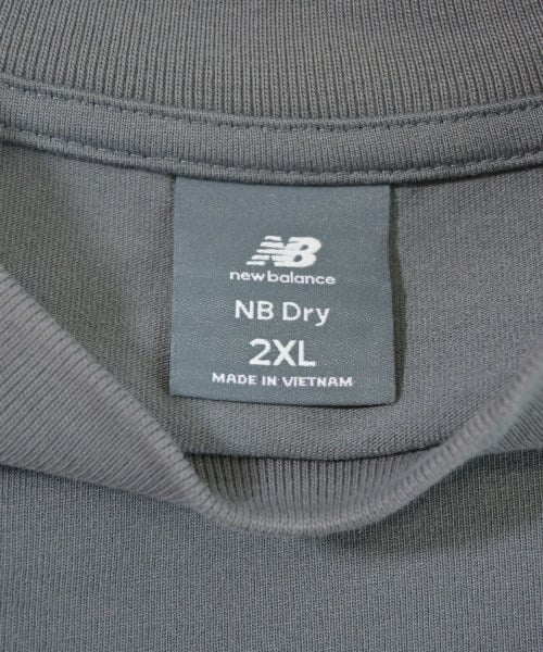 New Balance เสื้อยืด/เสื้อท็อปส์