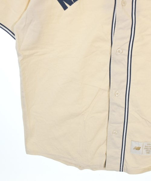 New Balance เสื้อยืด/เสื้อท็อปส์