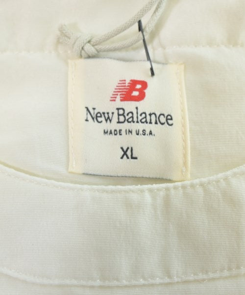 New Balance เสื้อยืด/เสื้อท็อปส์