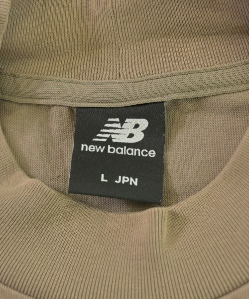 New Balance เสื้อยืด/เสื้อท็อปส์