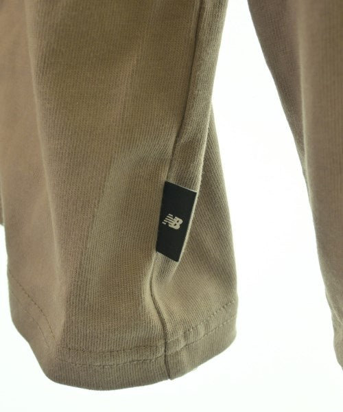 New Balance เสื้อยืด/เสื้อท็อปส์