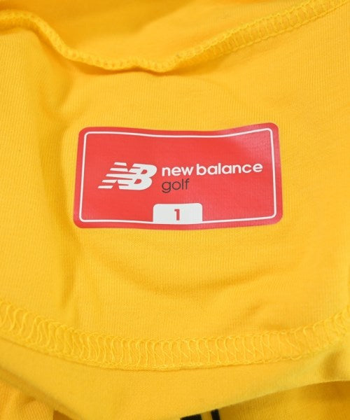 New Balance เสื้อยืด/เสื้อท็อปส์