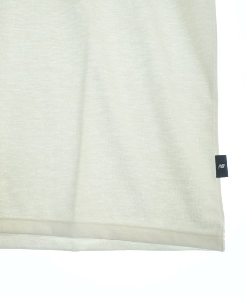 New Balance เสื้อยืด/เสื้อท็อปส์