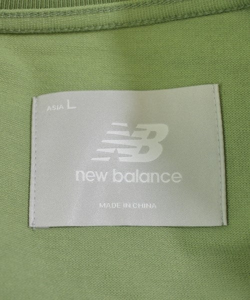 New Balance เสื้อยืด/เสื้อท็อปส์