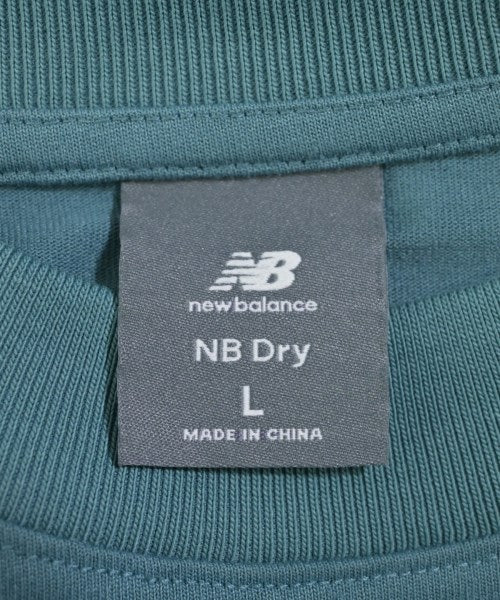 New Balance เสื้อยืด/เสื้อท็อปส์
