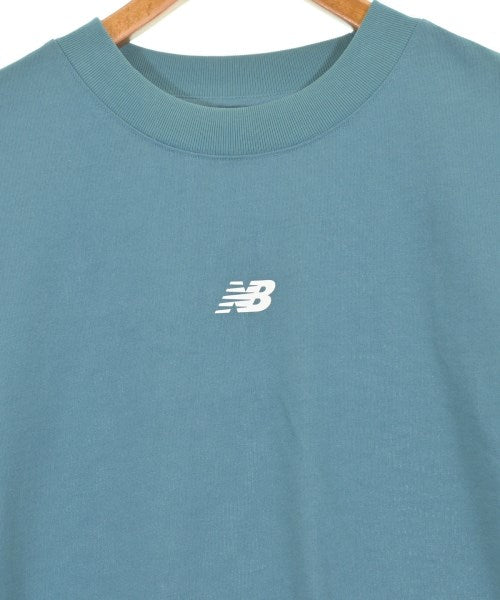 New Balance เสื้อยืด/เสื้อท็อปส์