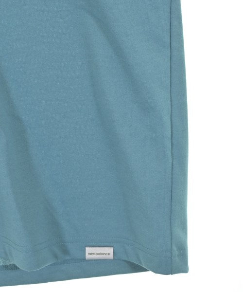 New Balance เสื้อยืด/เสื้อท็อปส์