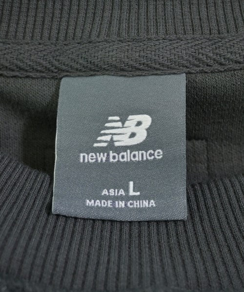 New Balance เสื้อยืด/เสื้อท็อปส์
